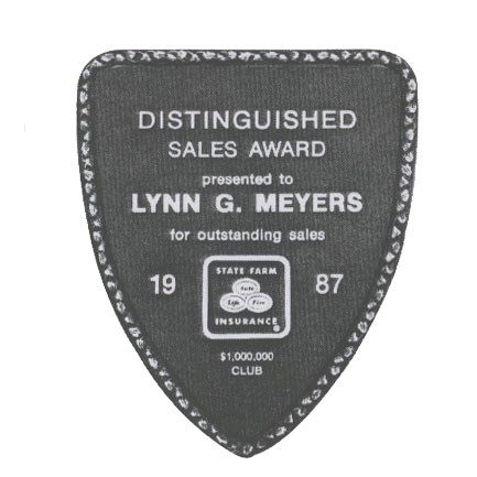 Cast plaque with decorative leaf border